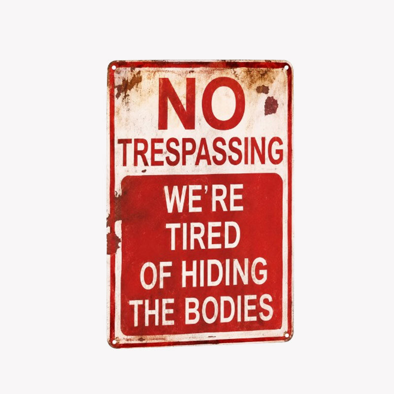 NO  TRESPASSING  WE'RE  TIRED  OF HIDING  THE BODIES